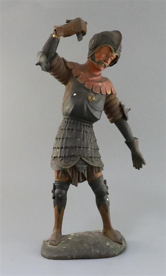 A Continental carved polychrome figure of a swordsman